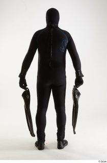 Jake Perry Diver with Fins holding diver fins standing whole…